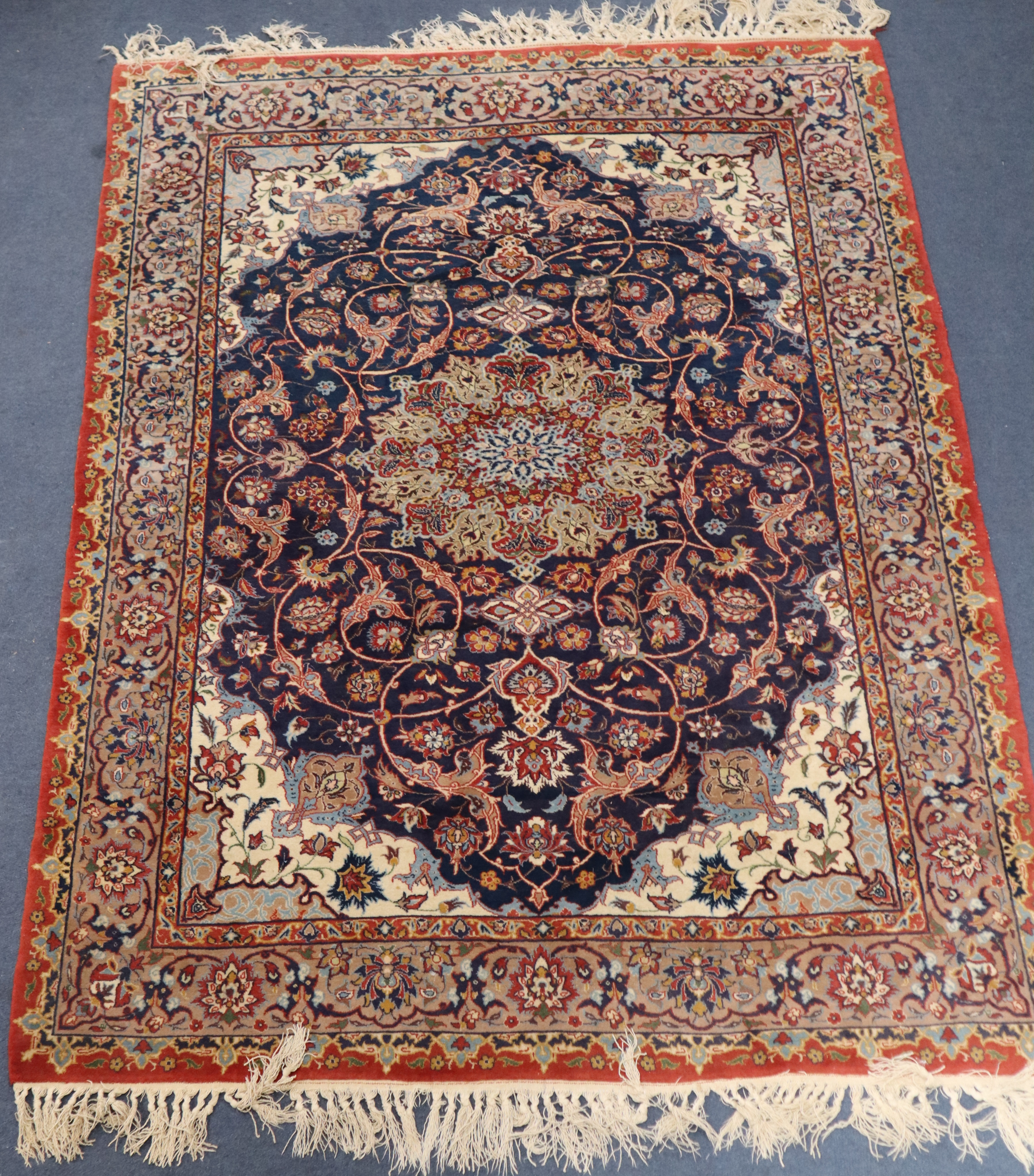 An Isphahan blue ground part silk rug, 142 x 105cm